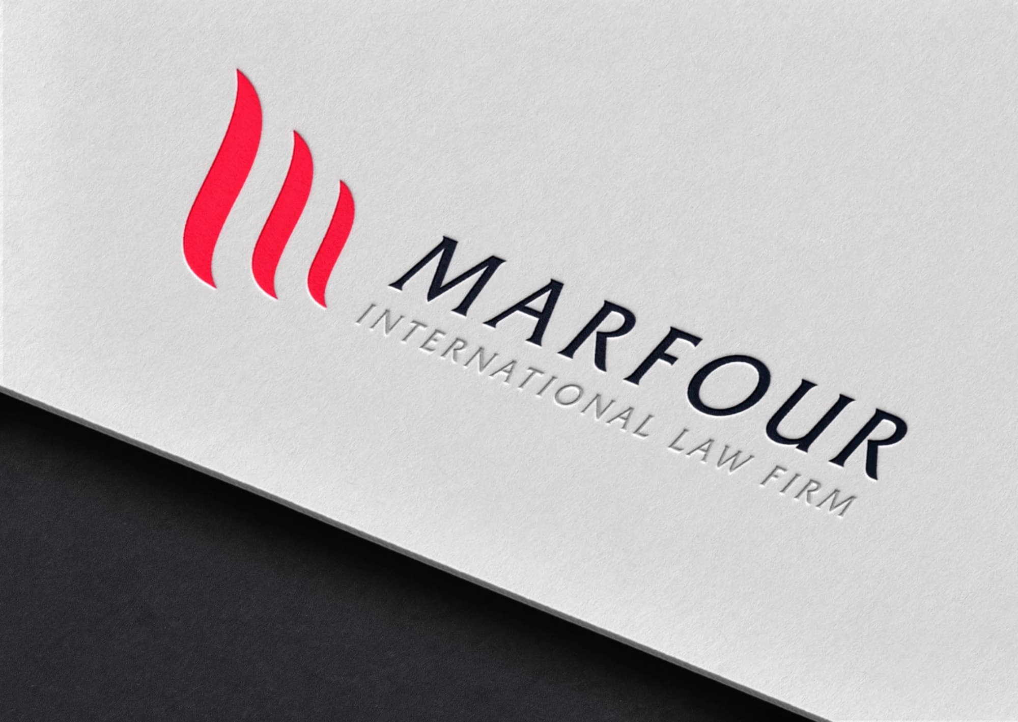 The Marfour International Law Firm logo, letterpressed in red and navy on white card